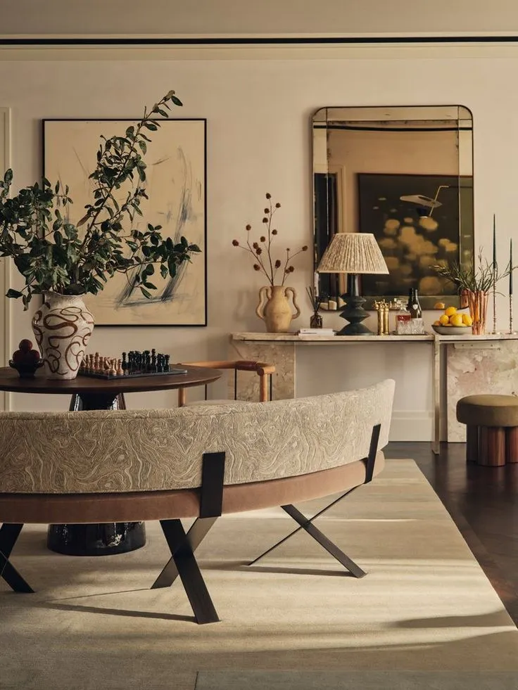 Curzon Street London apartment living room: warm neutrals, pleated and linen-shaded table lamps on side tables